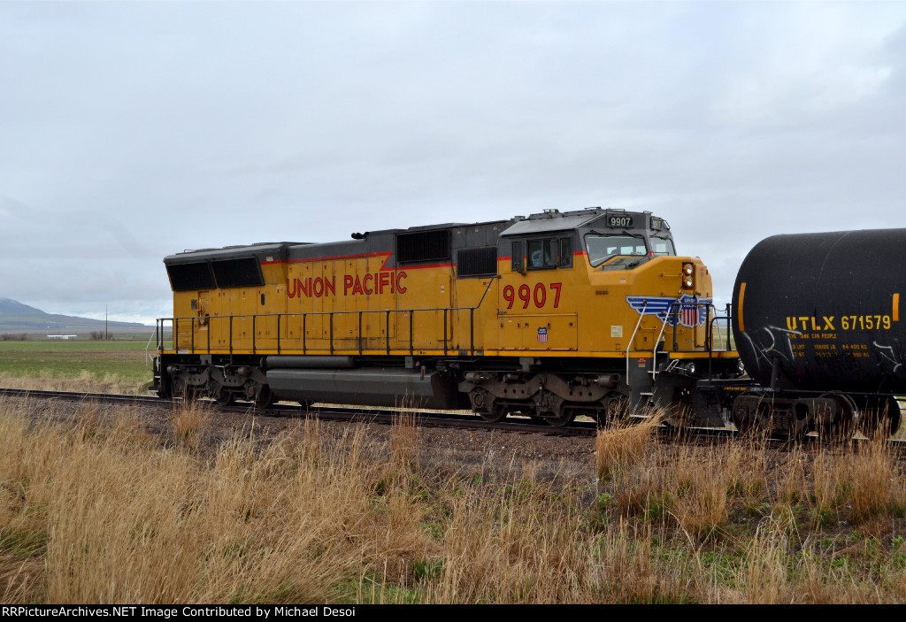 UP SD59MX #9907, running LHF, leads the southbound Cache Valley Local (LCG-41E) next to Utah Route 23 at Cache Junction, Utah. April 15, 2022